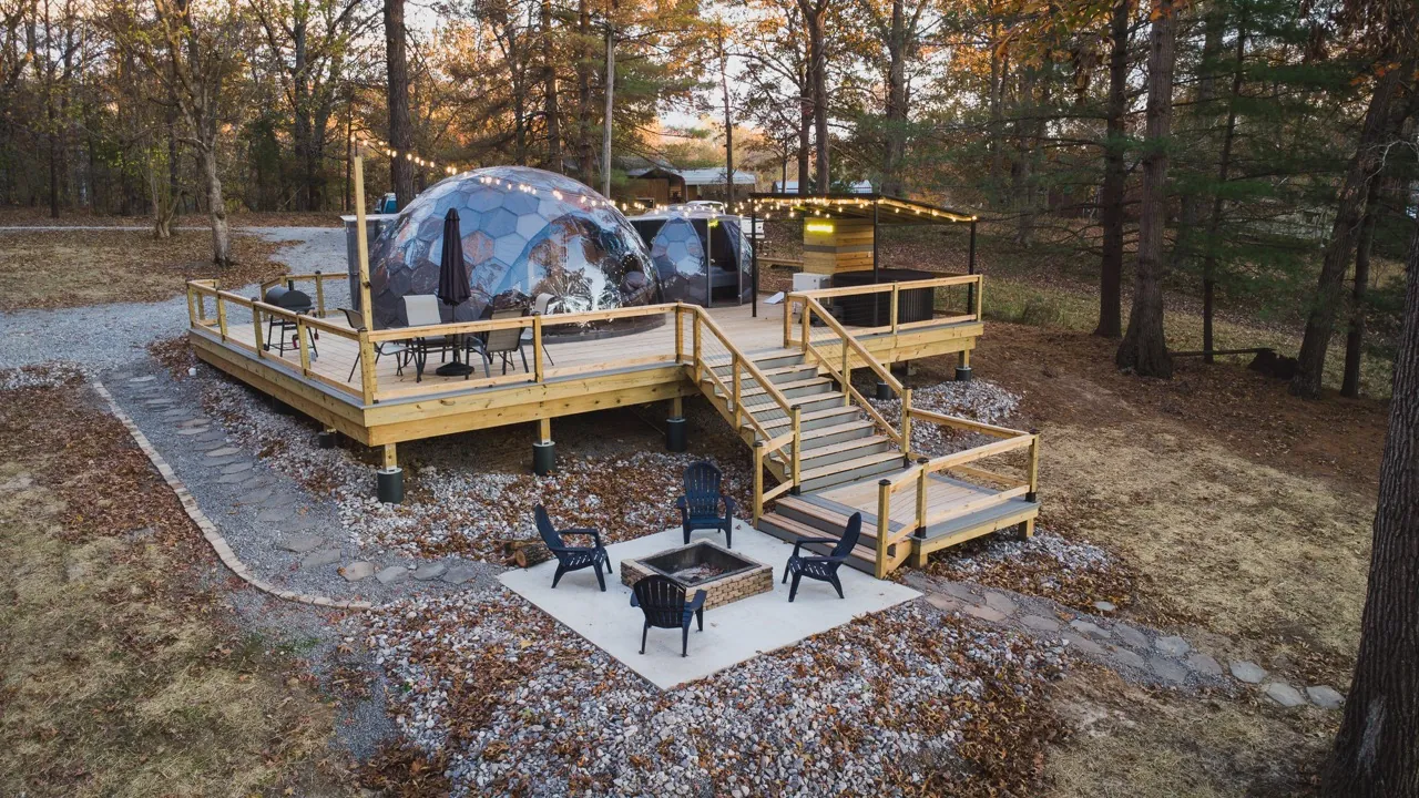 Aerial drone view of a Hypedome placed next to an existing cabin property