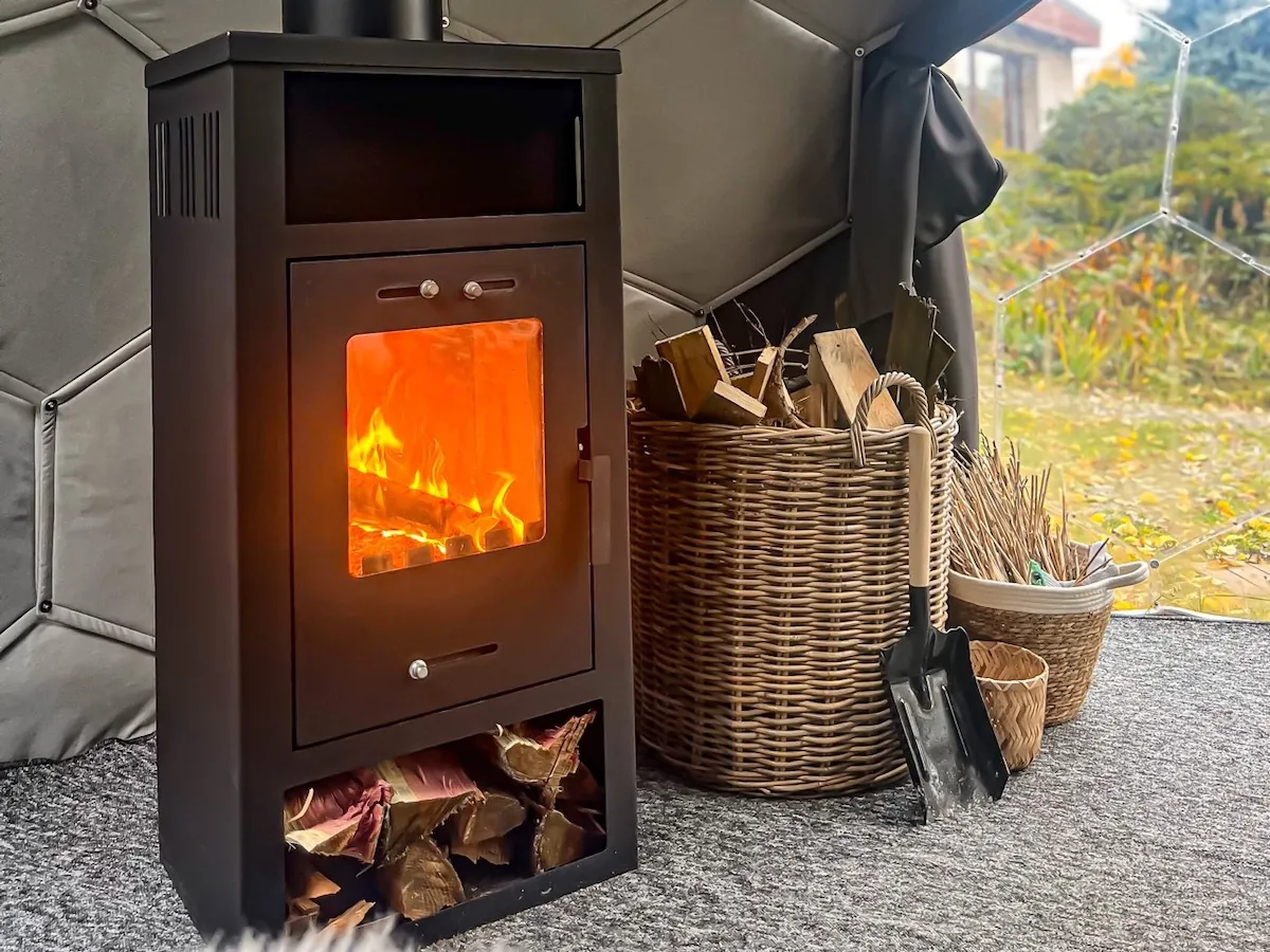 A wood burning stove inside a Hypedome