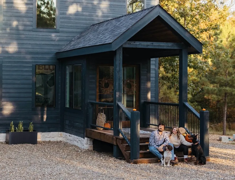 Helene Sula and Michael Sula in front of their Misty Blue cabin in Oklahoma