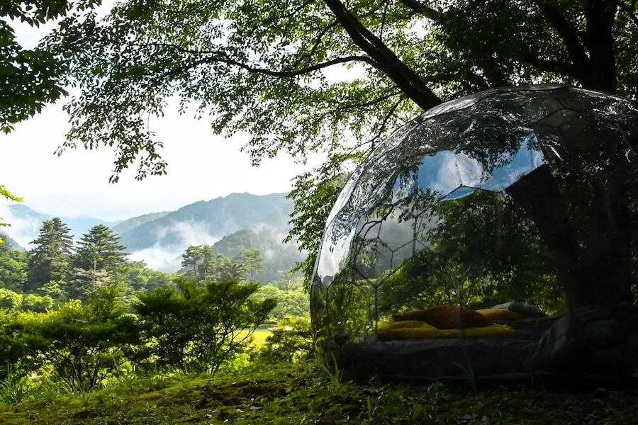 A glamping dome in a Japanese forest